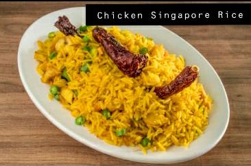 Plate of chicken Singapore rice with dry red chillies