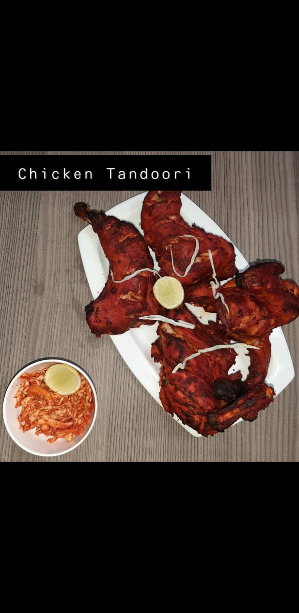 Chicken tandoori platter with lemon and salad