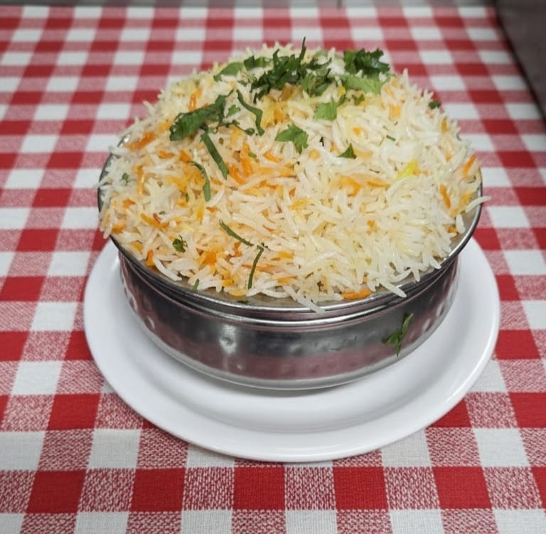 Steaming handi of fragrant biryani rice
