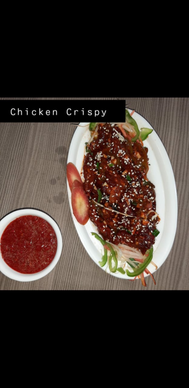 Crispy chicken tossed in sauce with sesame seeds